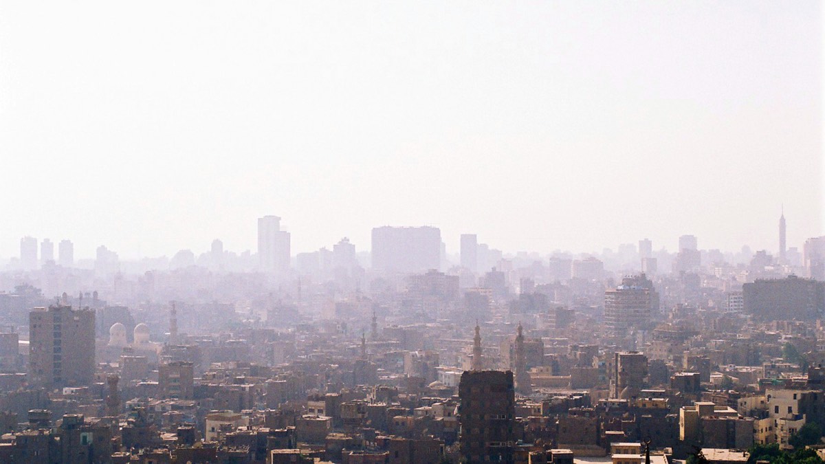 Hazy city skyline under a grey sky