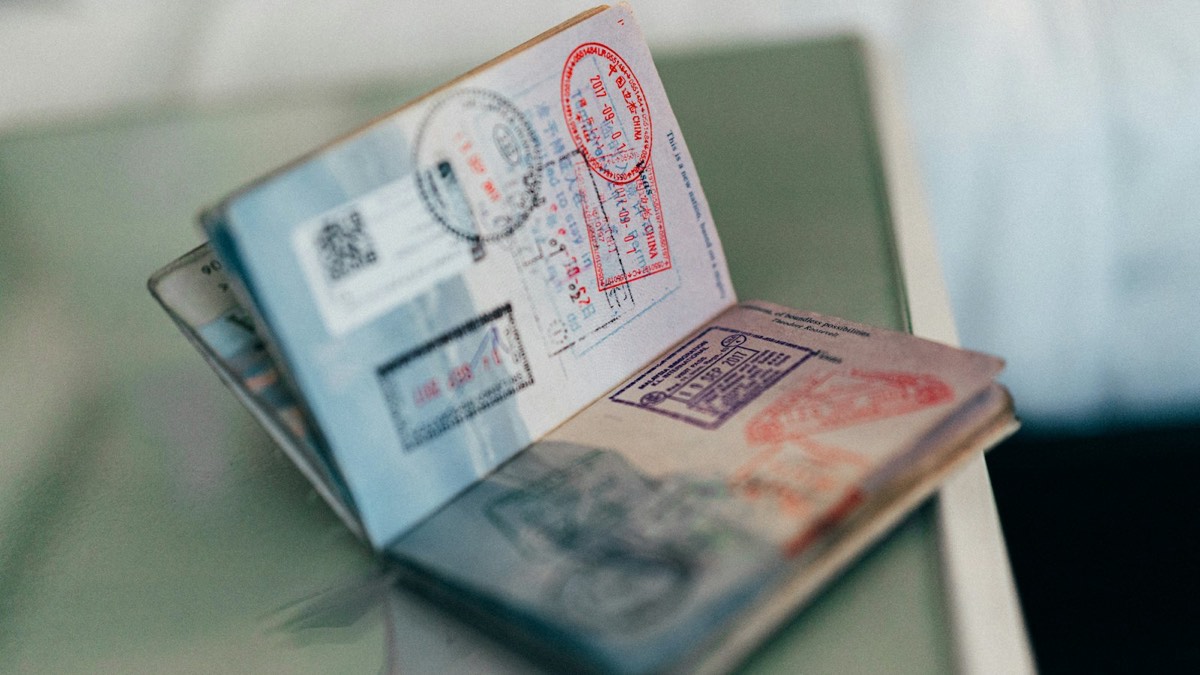 Open passport with entry stamps